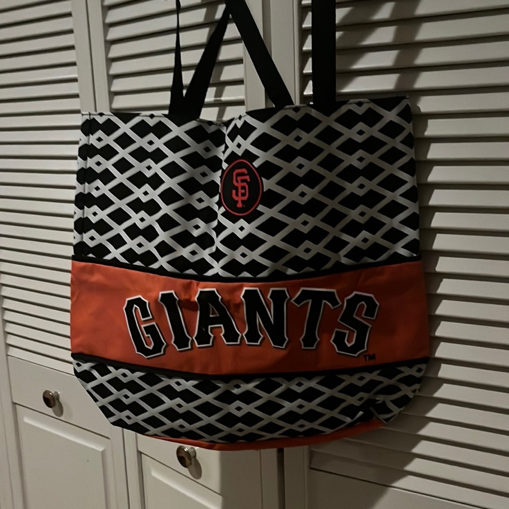 SF Giants vinyl tote bag with zipper to either expand or narrow sizing.